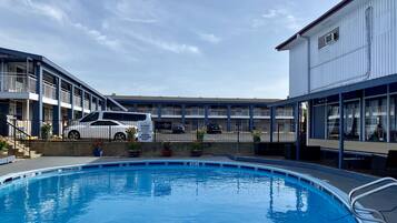 Outdoor pool, open 10:00 AM to 10:00 PM, free pool cabanas