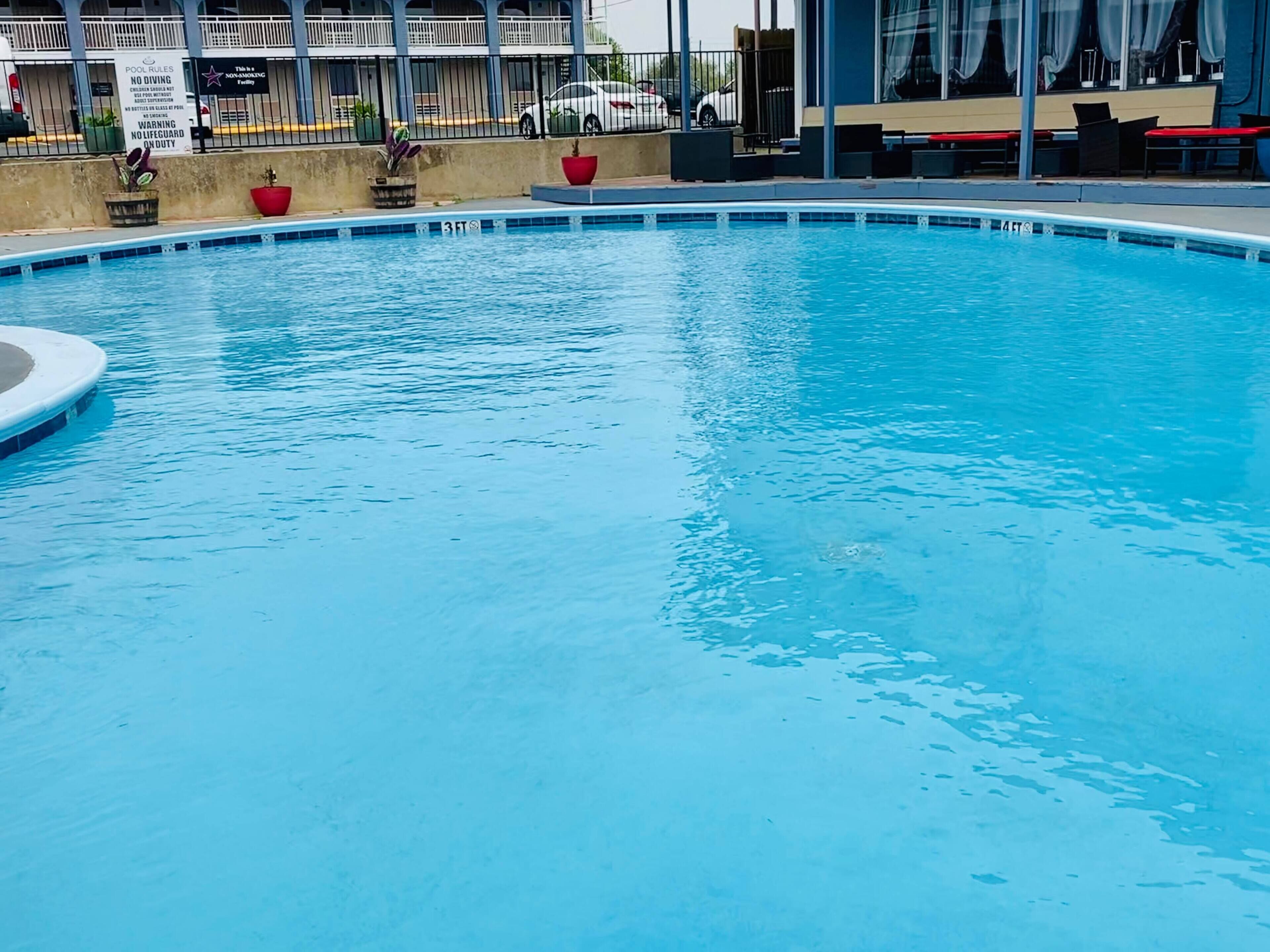 Outdoor pool, open 10:00 AM to 10:00 PM, free pool cabanas