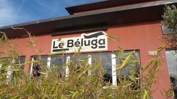A restaurant named 'Le Béluaga' with a red exterior and a signboard.