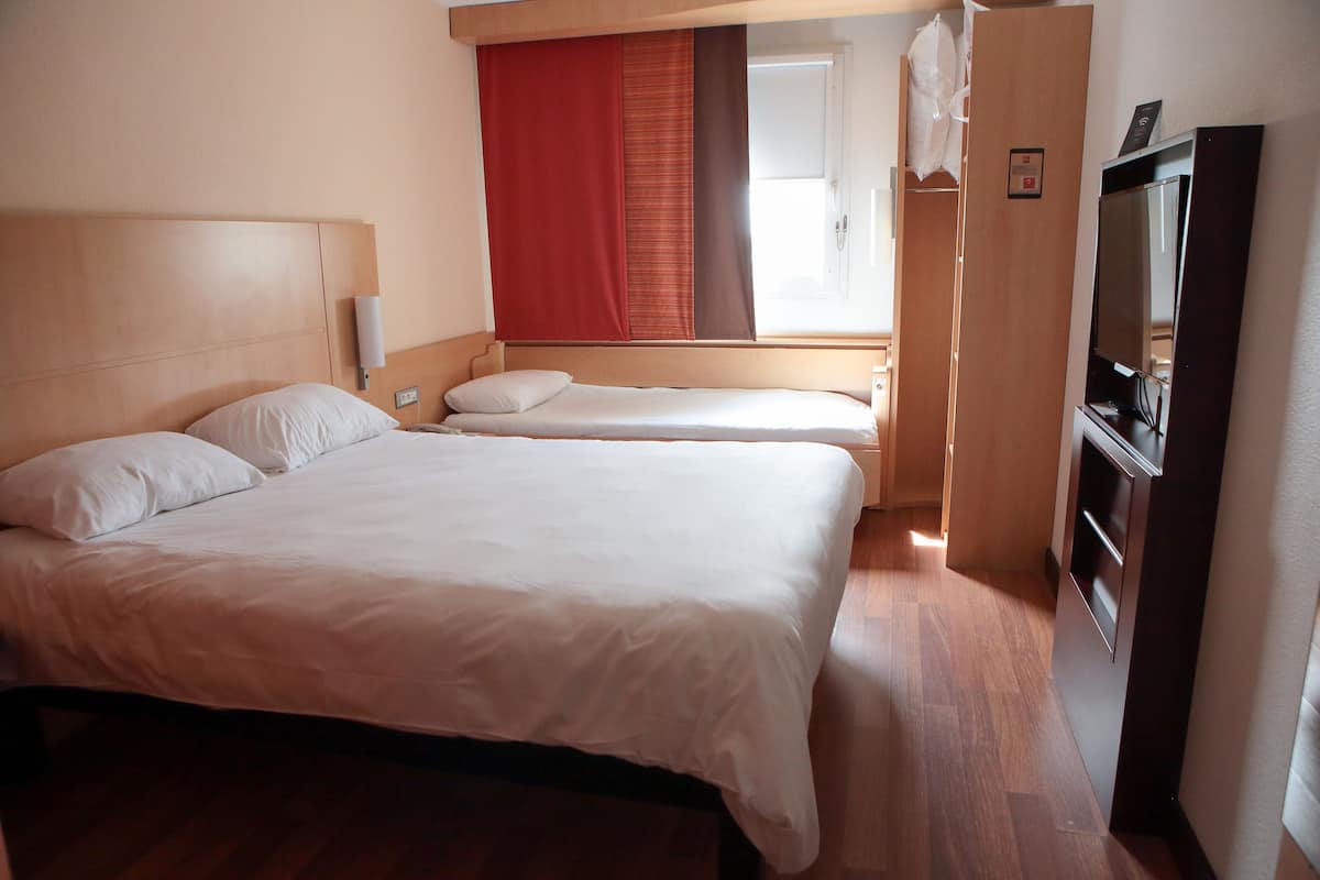 triple room, multiple beds | desk, blackout curtains, soundproofing, iron/ironing board