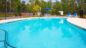 Seasonal outdoor pool, open 10:00 AM to 8:00 PM, pool loungers