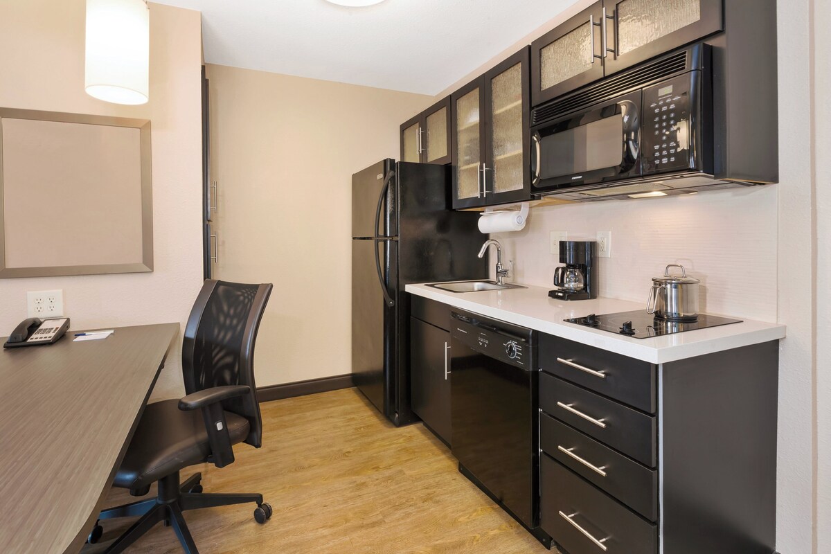 Premium bedding, desk, laptop workspace, blackout curtains