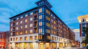 A multi-story hotel with a modern design, featuring large windows and a prominent rooftop structure. - ANDAZ SAVANNAH, BY HYATT (Savannah)