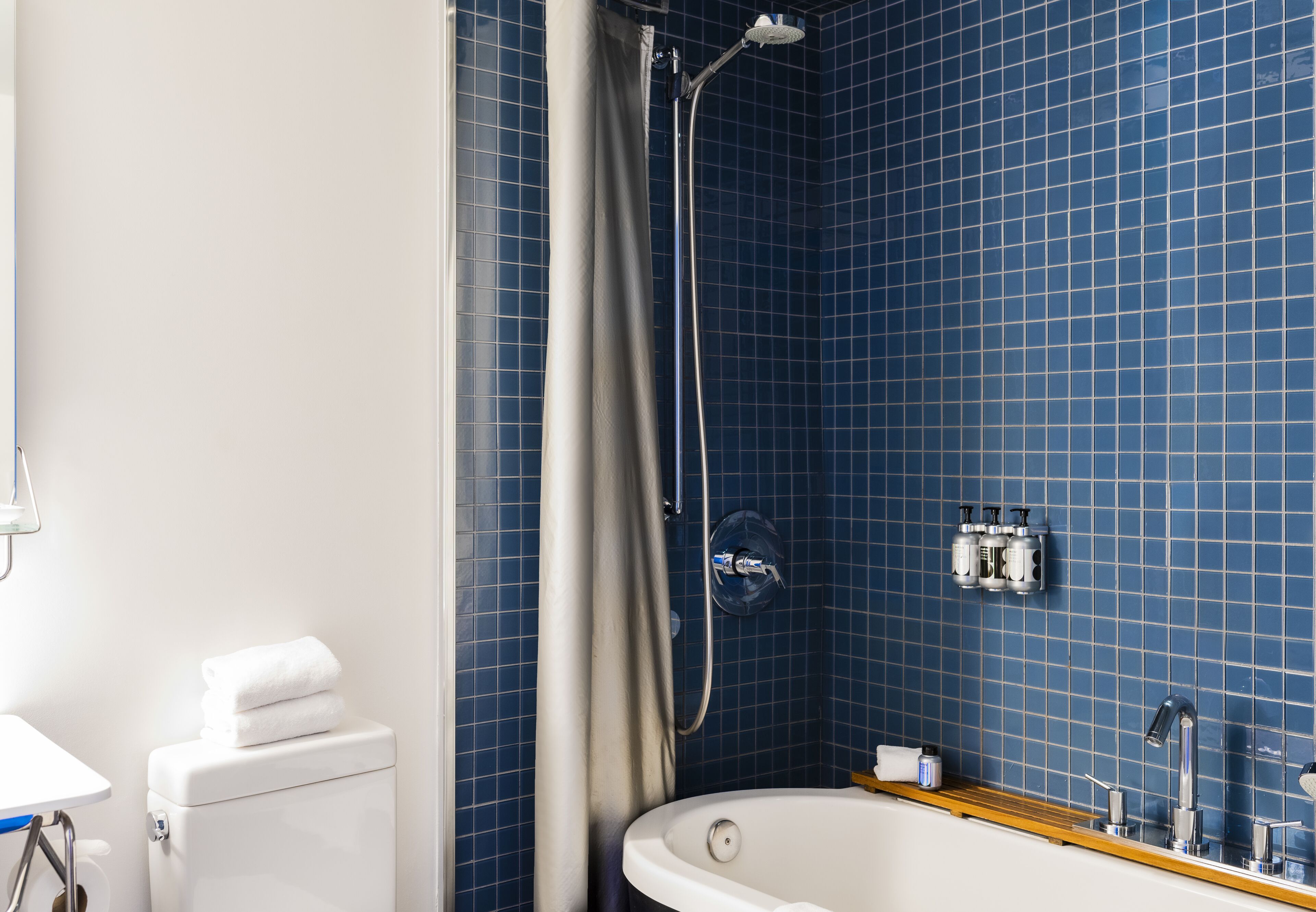 junior studio | bathroom | designer toiletries, hair dryer, bathrobes, slippers