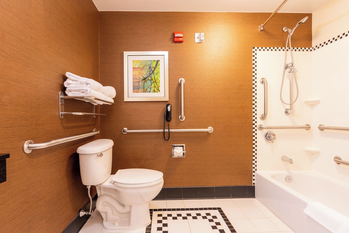 combined shower/bathtub, hair dryer, towels, soap