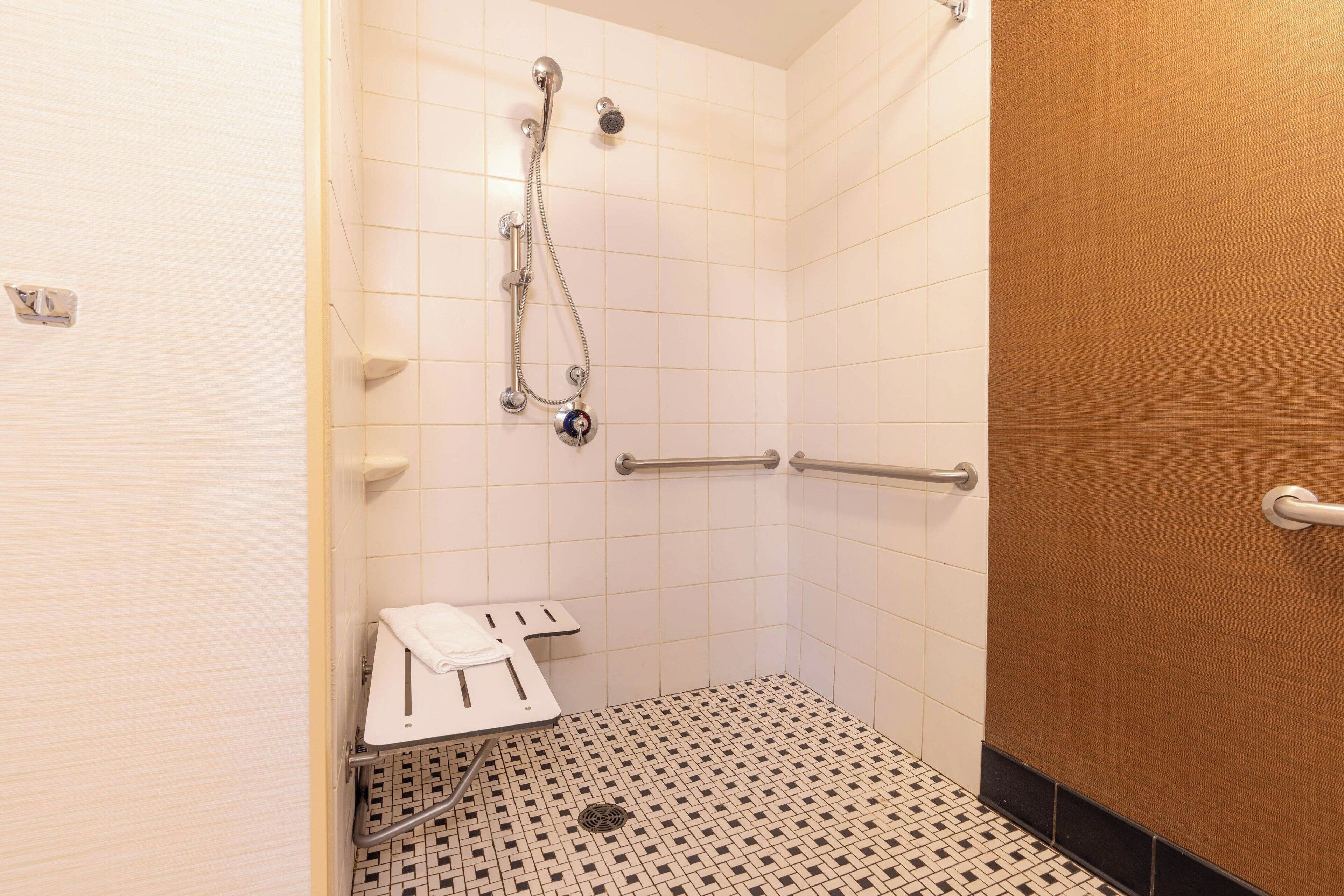 room, 1 king bed | bathroom | combined shower/bathtub, hair dryer, towels, soap