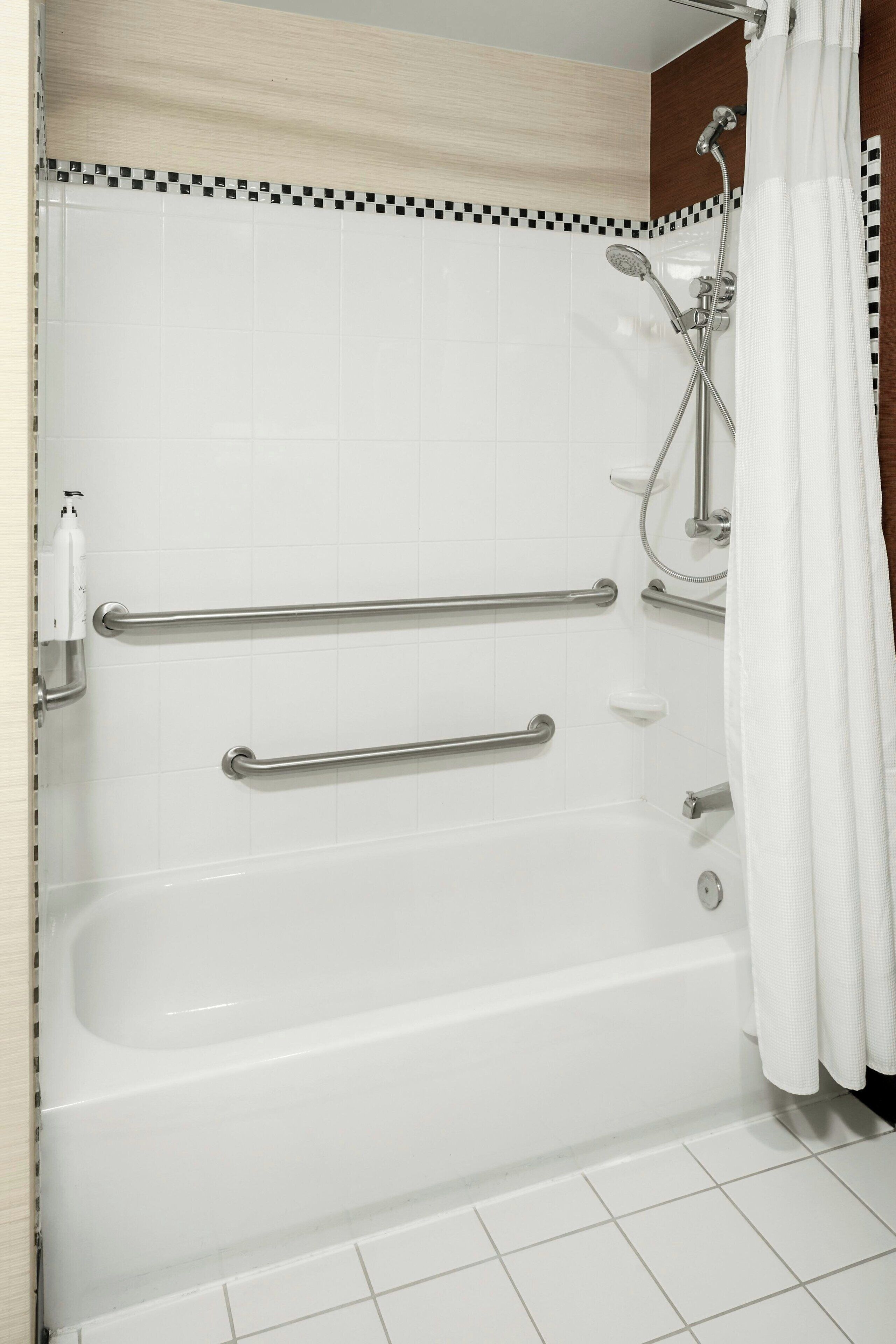 combined shower/bathtub, hair dryer, towels, soap