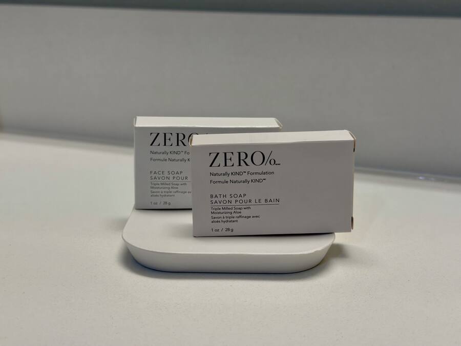 Two white boxes of ZERO% face and bath soap on a white surface.