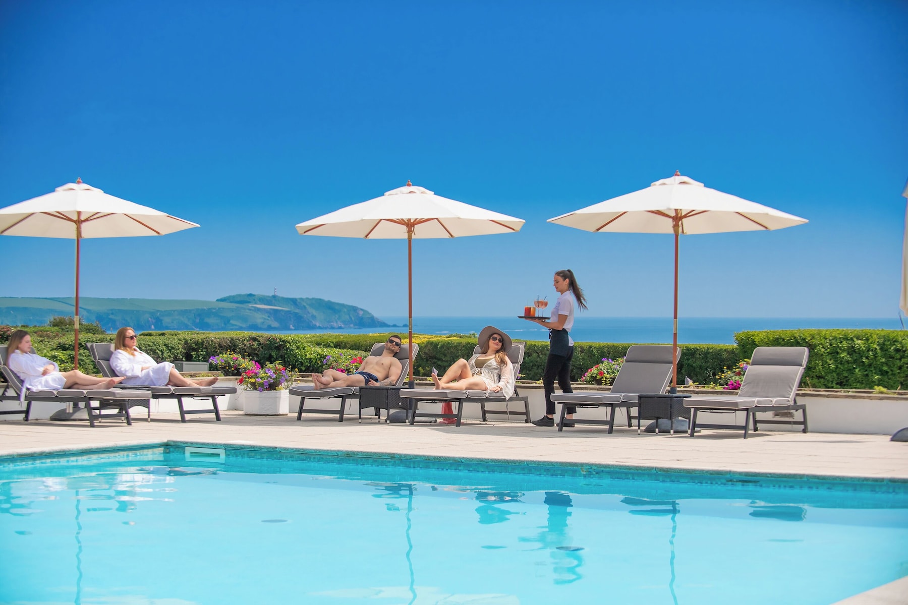 Indoor pool, seasonal outdoor pool, pool umbrellas, pool loungers