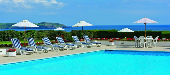 Indoor pool, seasonal outdoor pool, pool umbrellas, sun loungers