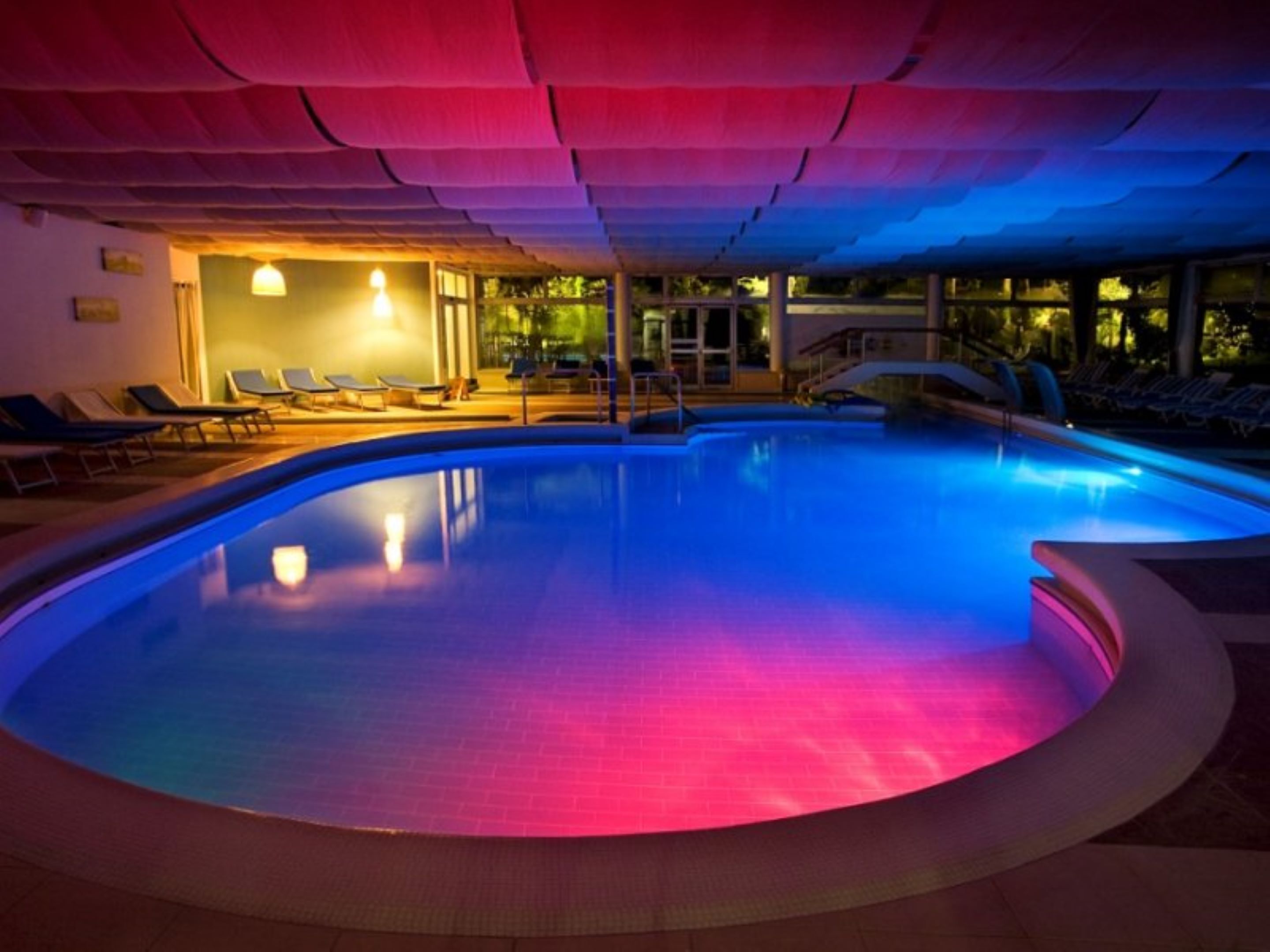 indoor pool, outdoor pool, pool umbrellas, pool loungers