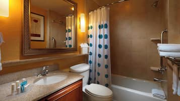 A bathroom with a sink, toilet, and bathtub.