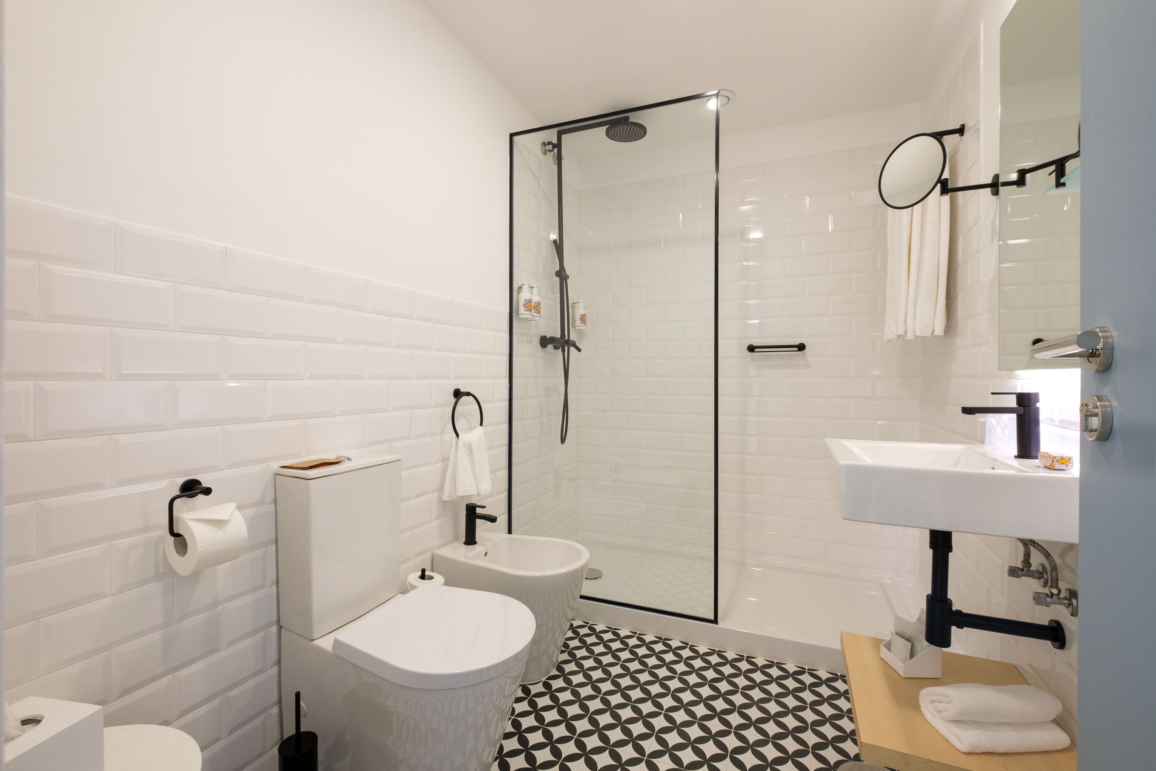 rainfall showerhead, designer toiletries, hair dryer, slippers