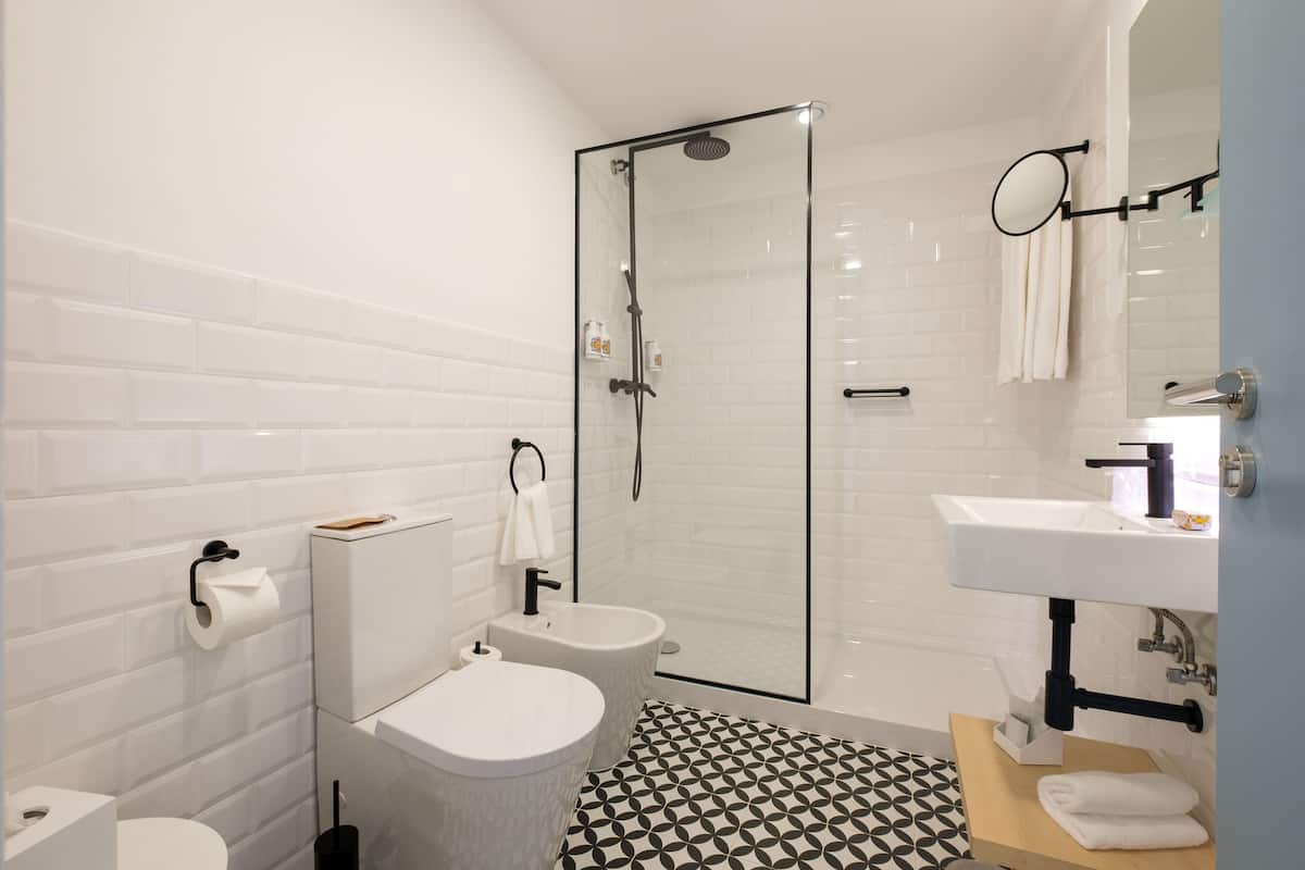 rainfall showerhead, designer toiletries, hair dryer, slippers