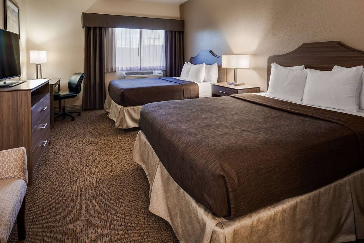 standard room, 2 queen beds, non smoking, refrigerator & microwave | desk, laptop workspace, iron/ironing board, wifi