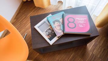 A book titled 'LifestyleHotels The Book' on a dark wooden table.