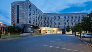 A modern hotel with a distinctive architectural design, featuring a prominent corner building and a large entrance area. - Quality Hotel Ostrava City (Ostrava)