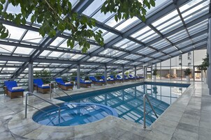 Indoor pool, open 11:00 AM to 8:00 PM, pool umbrellas