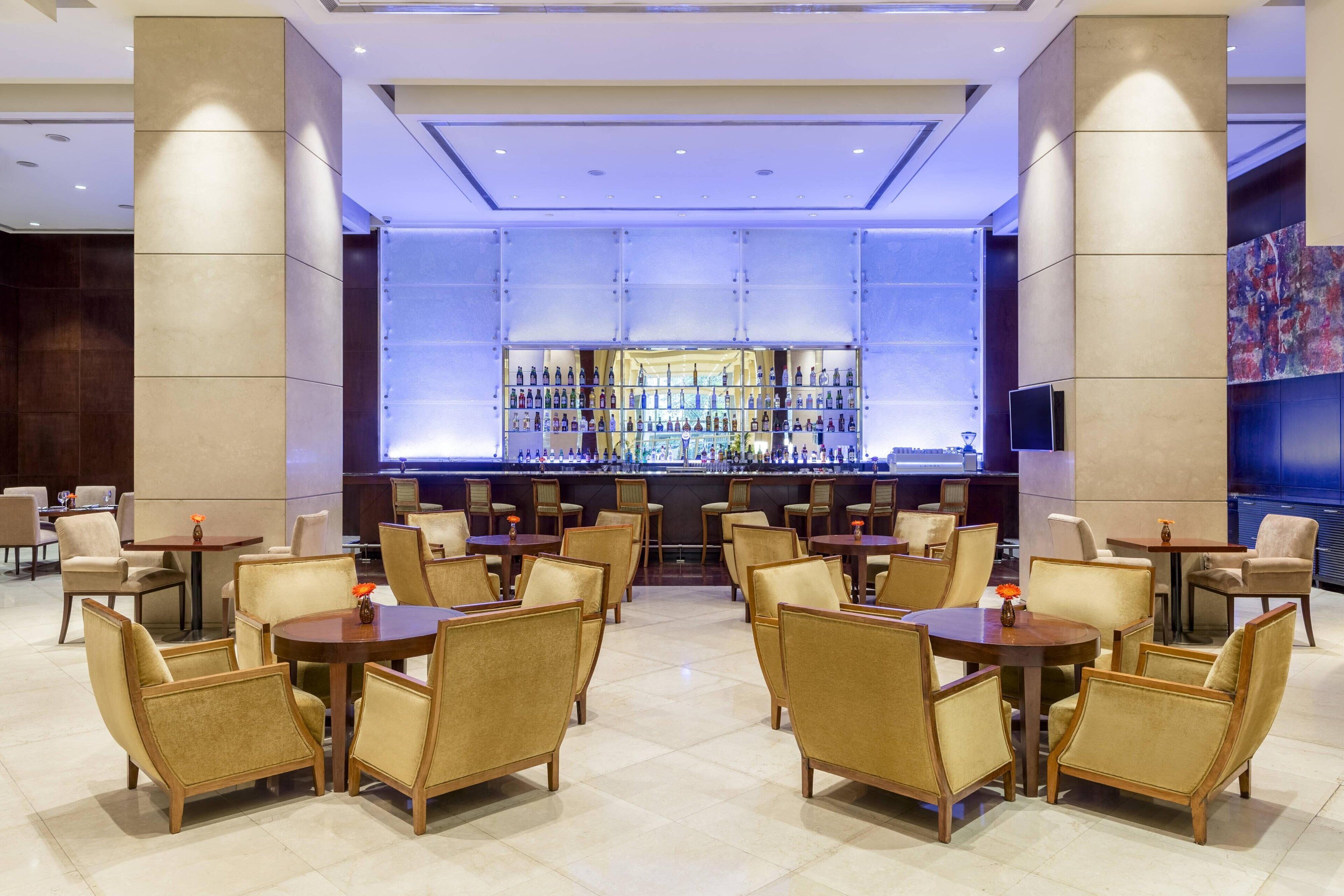 A bar area with multiple seating options and a well-lit interior.