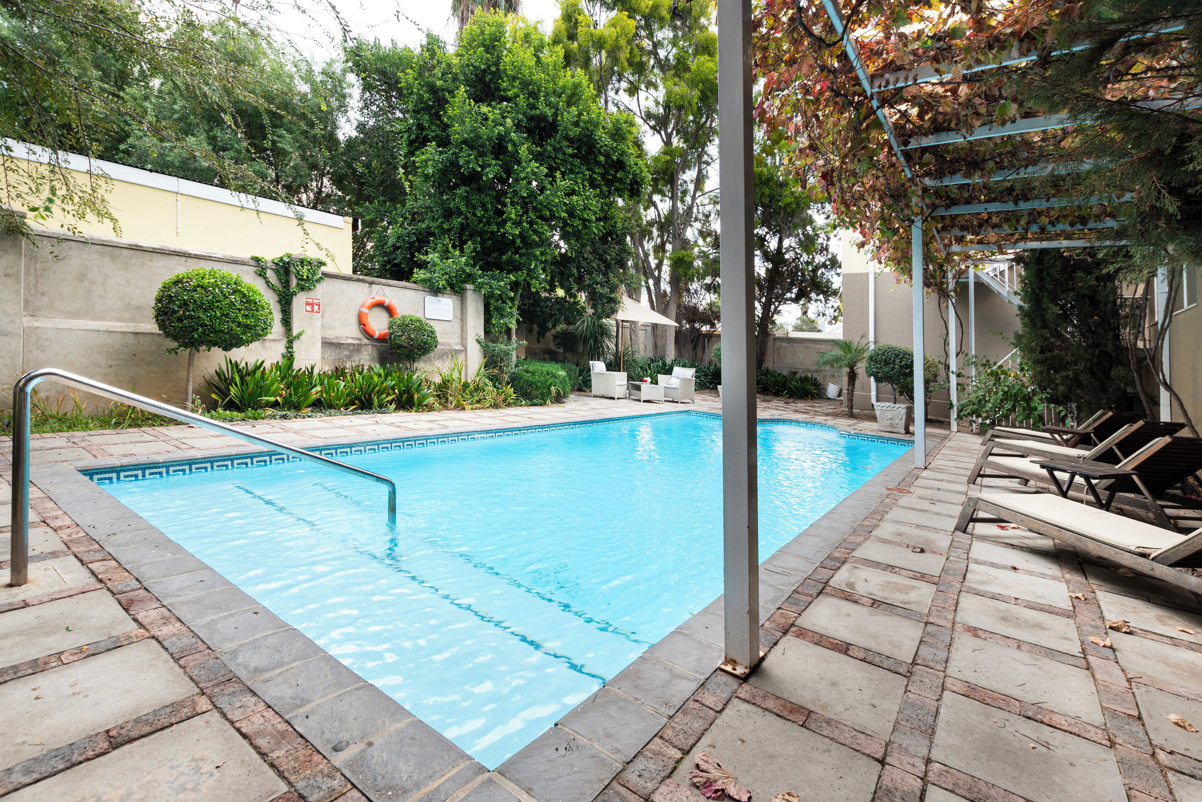 outdoor pool, pool umbrellas, pool loungers