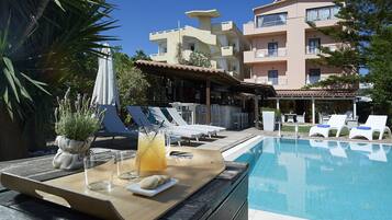 Outdoor pool, pool umbrellas, pool loungers