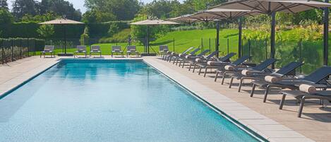 Seasonal outdoor pool, open 9:30 AM to 8:30 PM, pool umbrellas