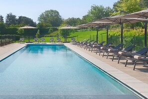 Seasonal outdoor pool, open 9:30 AM to 7:30 PM, pool umbrellas