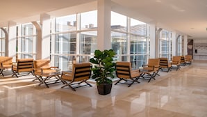 A spacious lobby with modern seating and large windows.