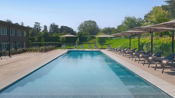 Seasonal outdoor pool, open 9:30 AM to 7:30 PM, pool umbrellas