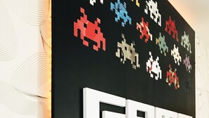 A wall with a retro gaming theme, including pixelated game characters and the text "GAME OVER". - Bad - Bed & Breakfast and Design (Catania)