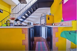 Studio Suite | Private kitchen | Fridge, electric kettle