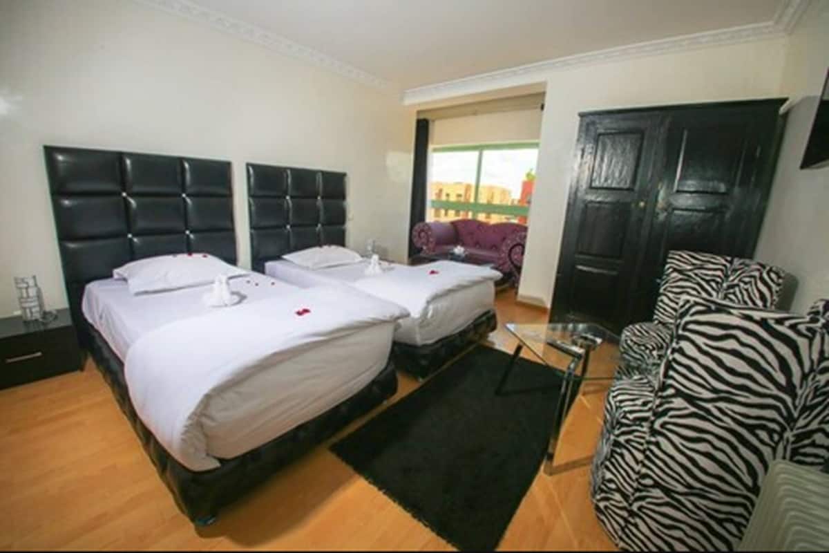 Standaard kamer | Een minibar, een kluis op de kamer, gratis wifi, beddengoed