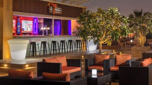A bar area with stools, a counter, and a sign that reads 'THE TERRACE.' - Radisson Blu Hotel, Dubai Barsha Heights (Dubai)