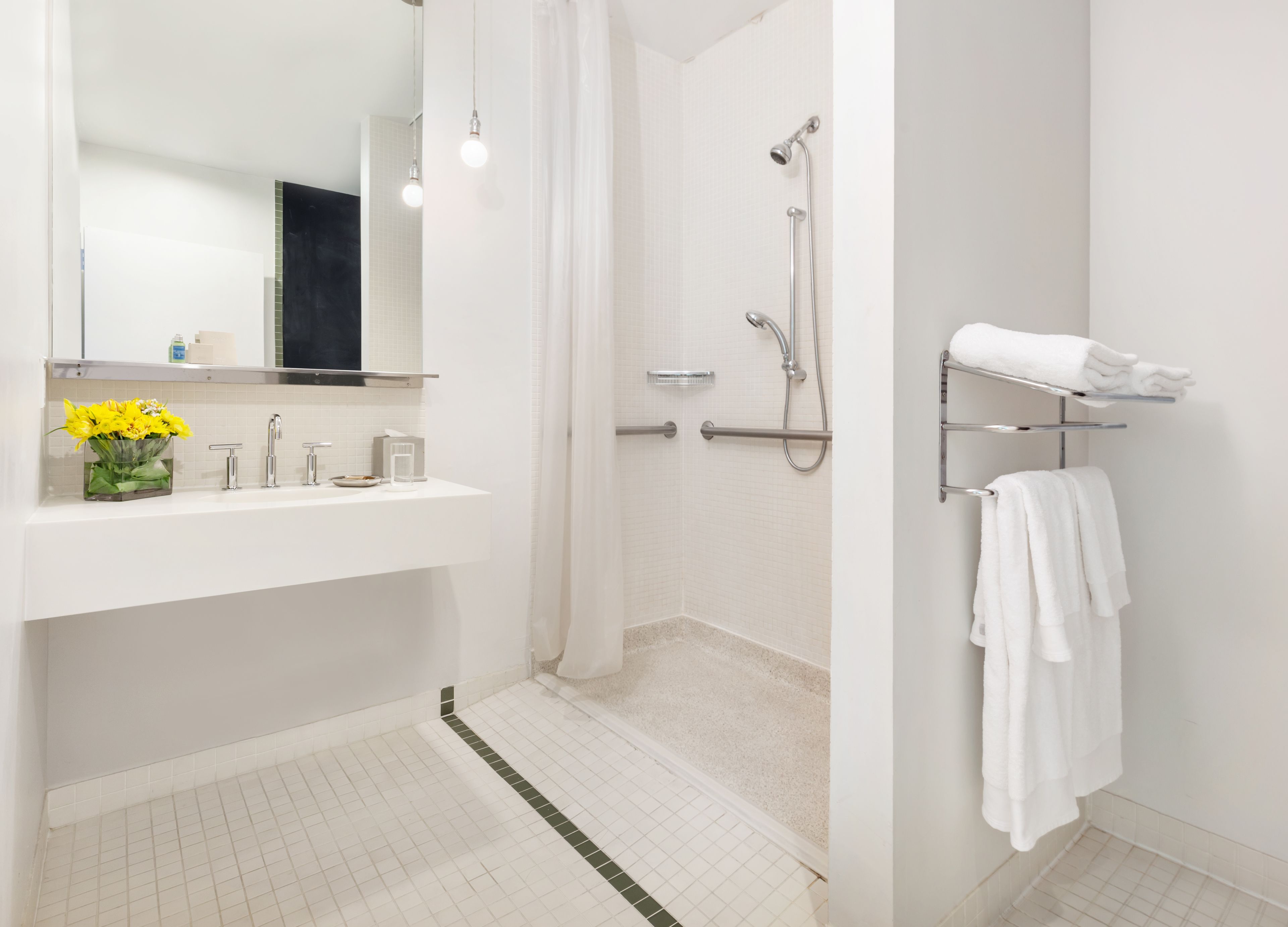 mobility accessible queen room | bathroom | free toiletries, hair dryer, bathrobes, towels