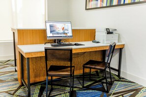 A hotel room with a desk, computer, printer, and two chairs. - Holiday Inn Express Greenville by IHG (Greenville)