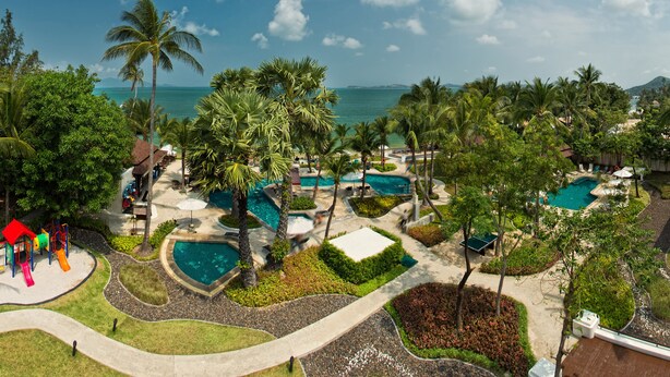 A resort with multiple swimming pools, palm trees, and a playground. - ibis Samui Bophut (Koh Samui)