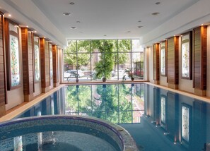 Indoor pool, open 5:00 PM to 9:00 PM, pool loungers