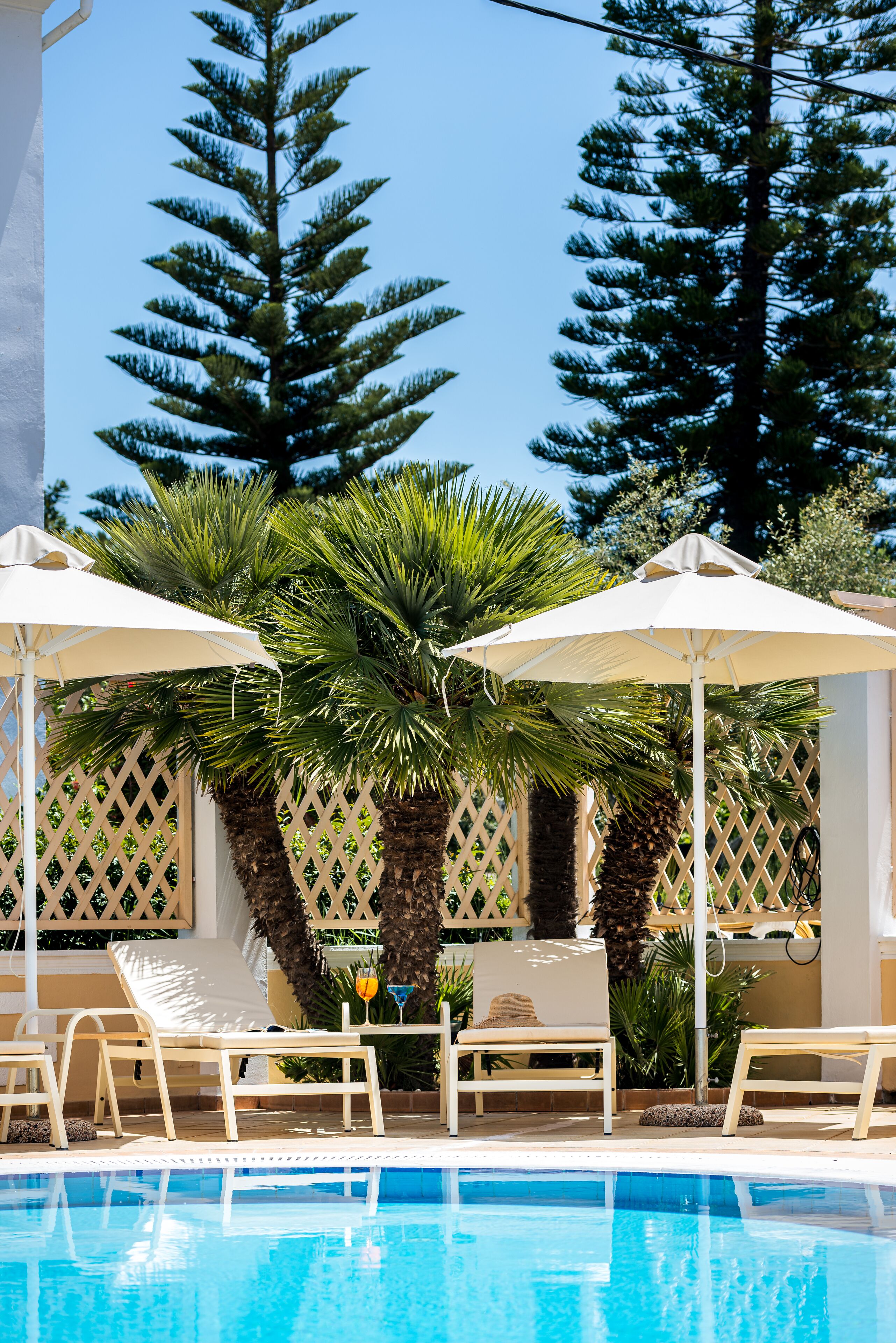 Seasonal outdoor pool, open 9:00 AM to 8:00 PM, pool umbrellas