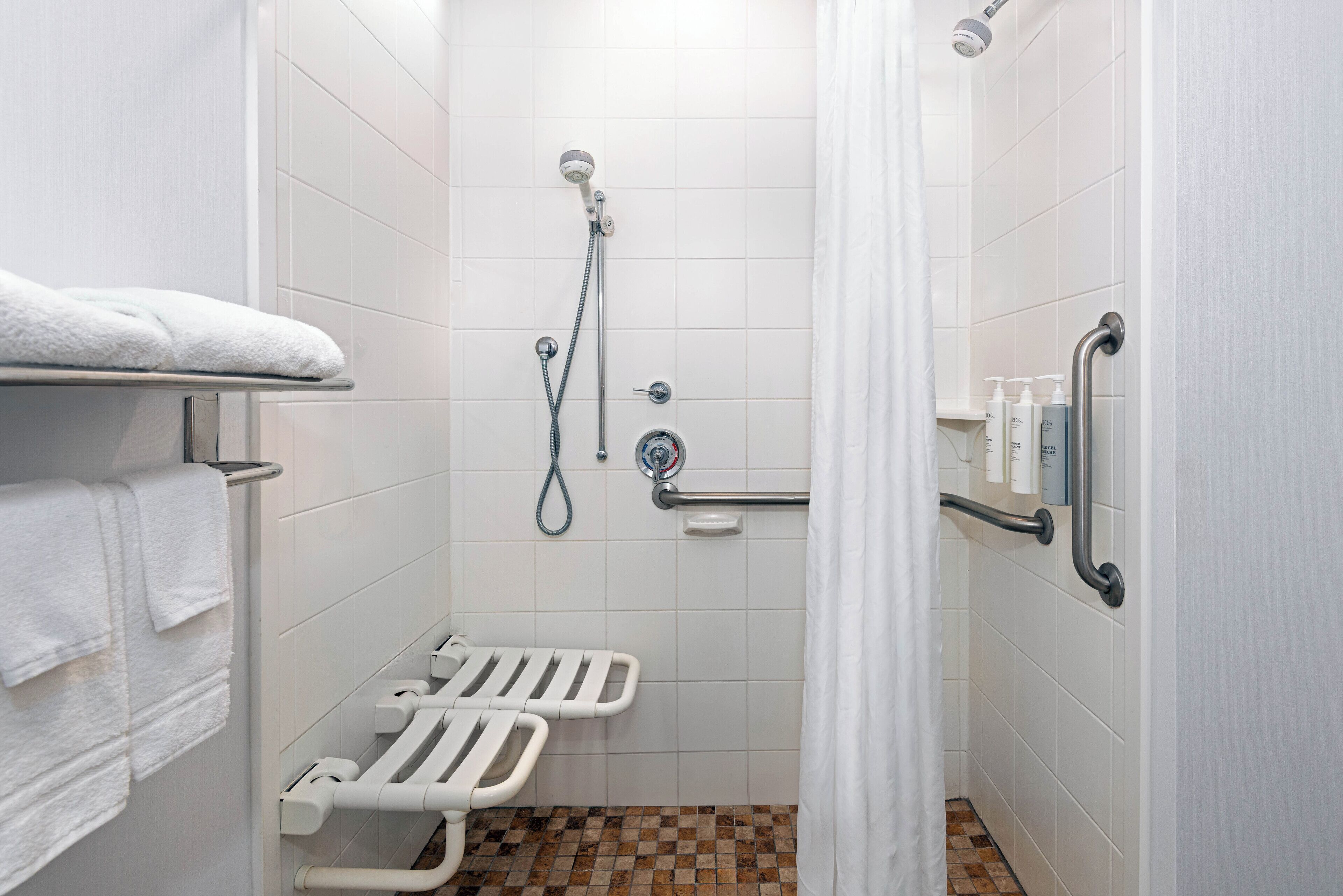 combined shower/bathtub, free toiletries, hair dryer, towels