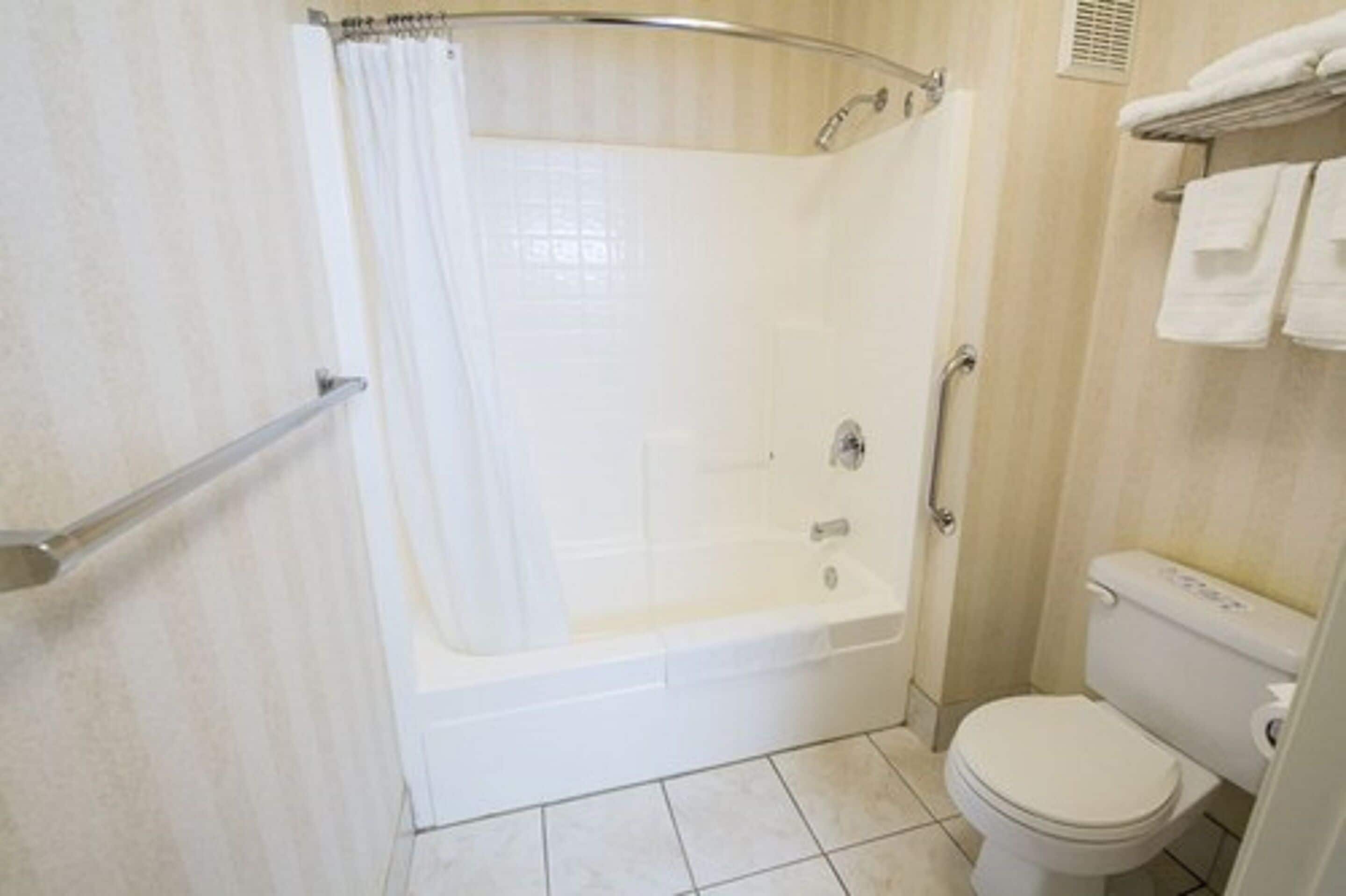 junior suite, 2 queen beds | bathroom | combined shower/bathtub, hair dryer, towels
