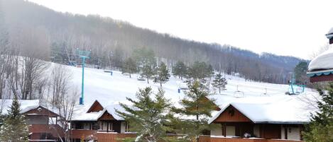 A ski resort with cabins and a parking lot.