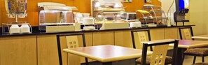 A breakfast bar with self-service options, including a cereal dispenser and a coffee machine. - Holiday Inn Express & Suites Borger by IHG (Borger)