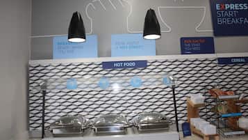 A breakfast buffet area with labeled sections for hot food and cereal, and a sign promoting Express Start Breakfast.