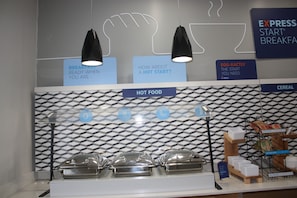 A breakfast buffet area with labeled sections for hot food and cereal, and a sign promoting Express Start Breakfast. - Holiday Inn Express Hotel & Suites Shamrock North by IHG (Shamrock)
