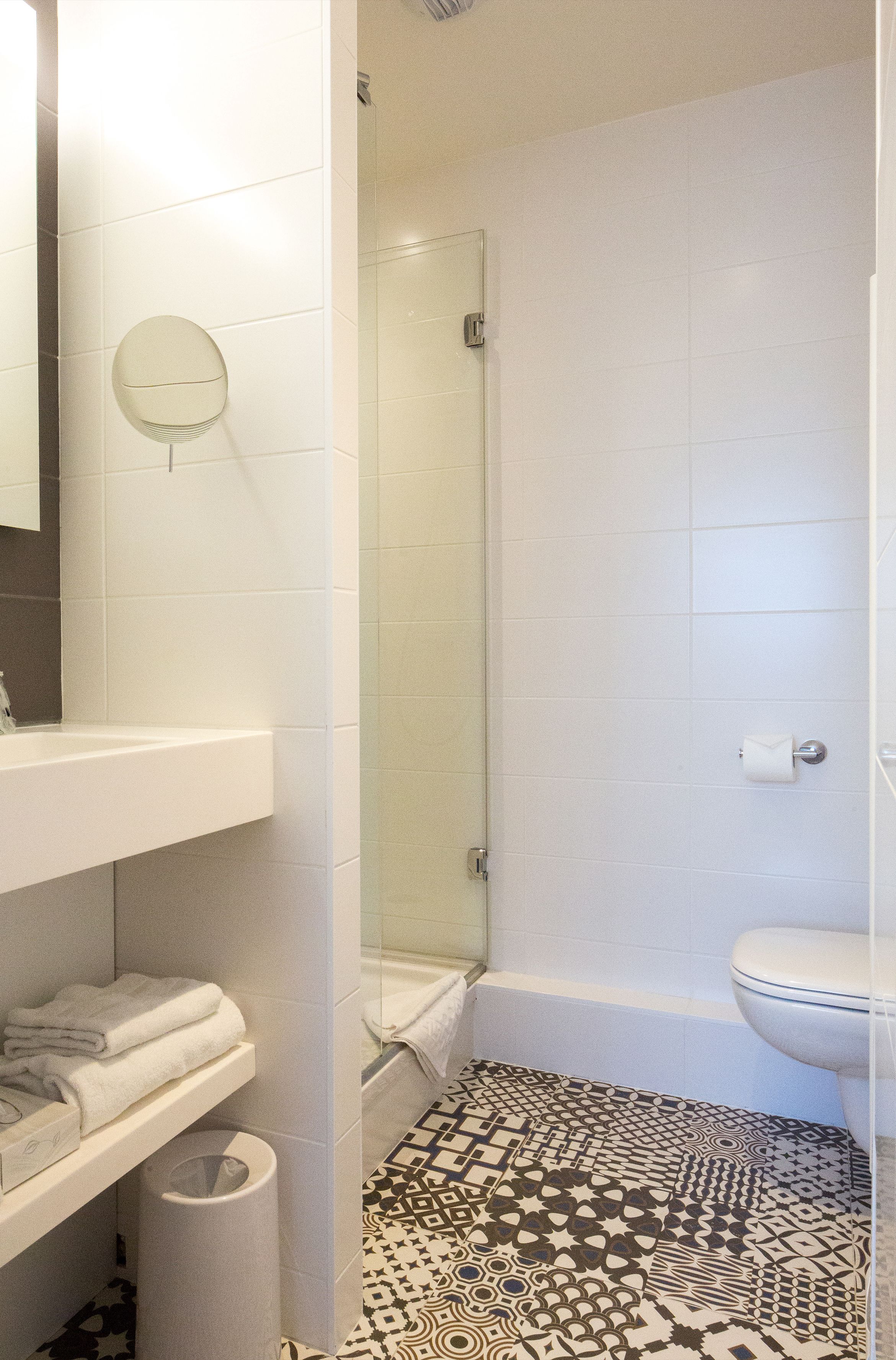 standard double room | bathroom | shower, rainfall showerhead, hair dryer, towels