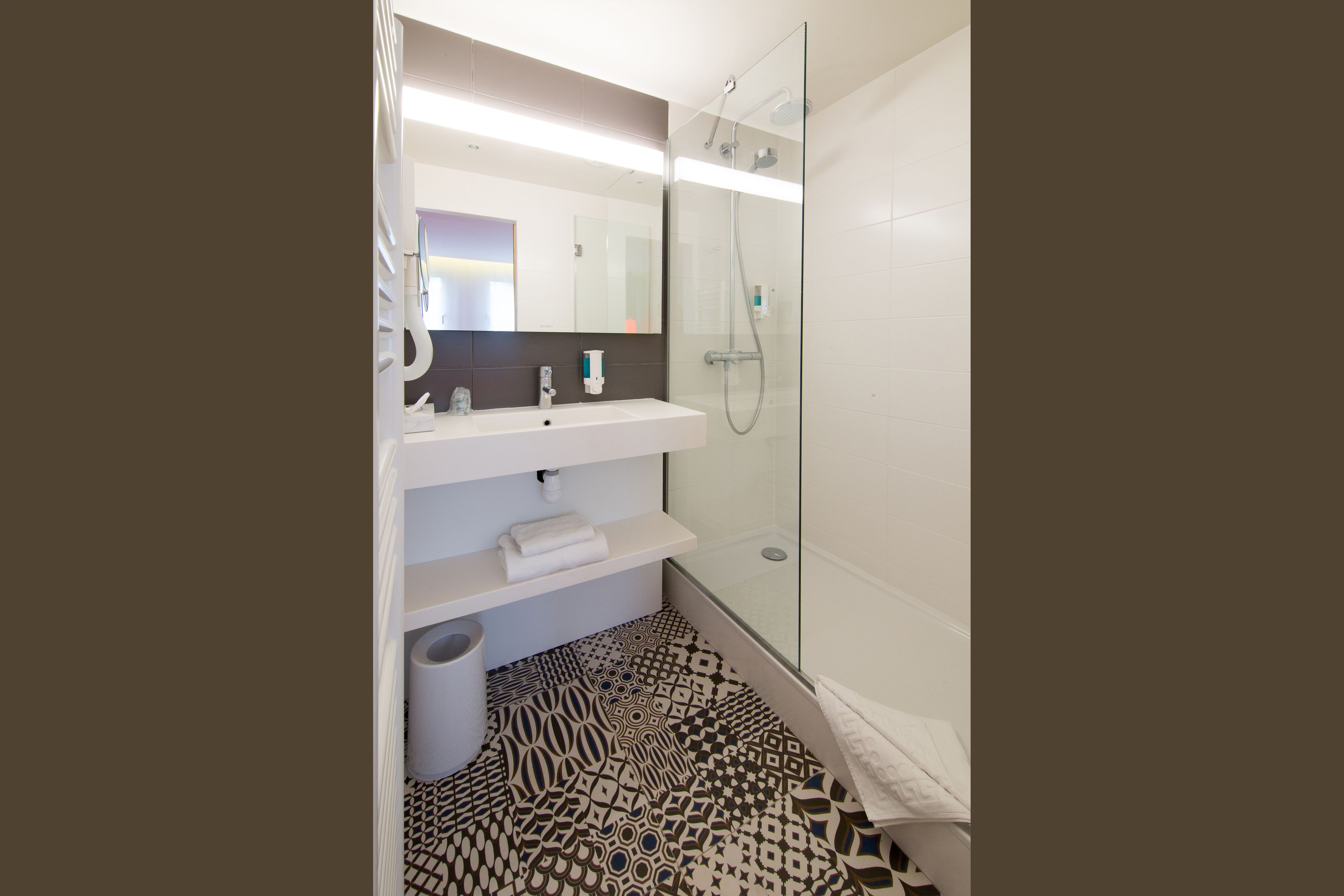 quadruple room | bathroom | shower, rainfall showerhead, hair dryer, towels