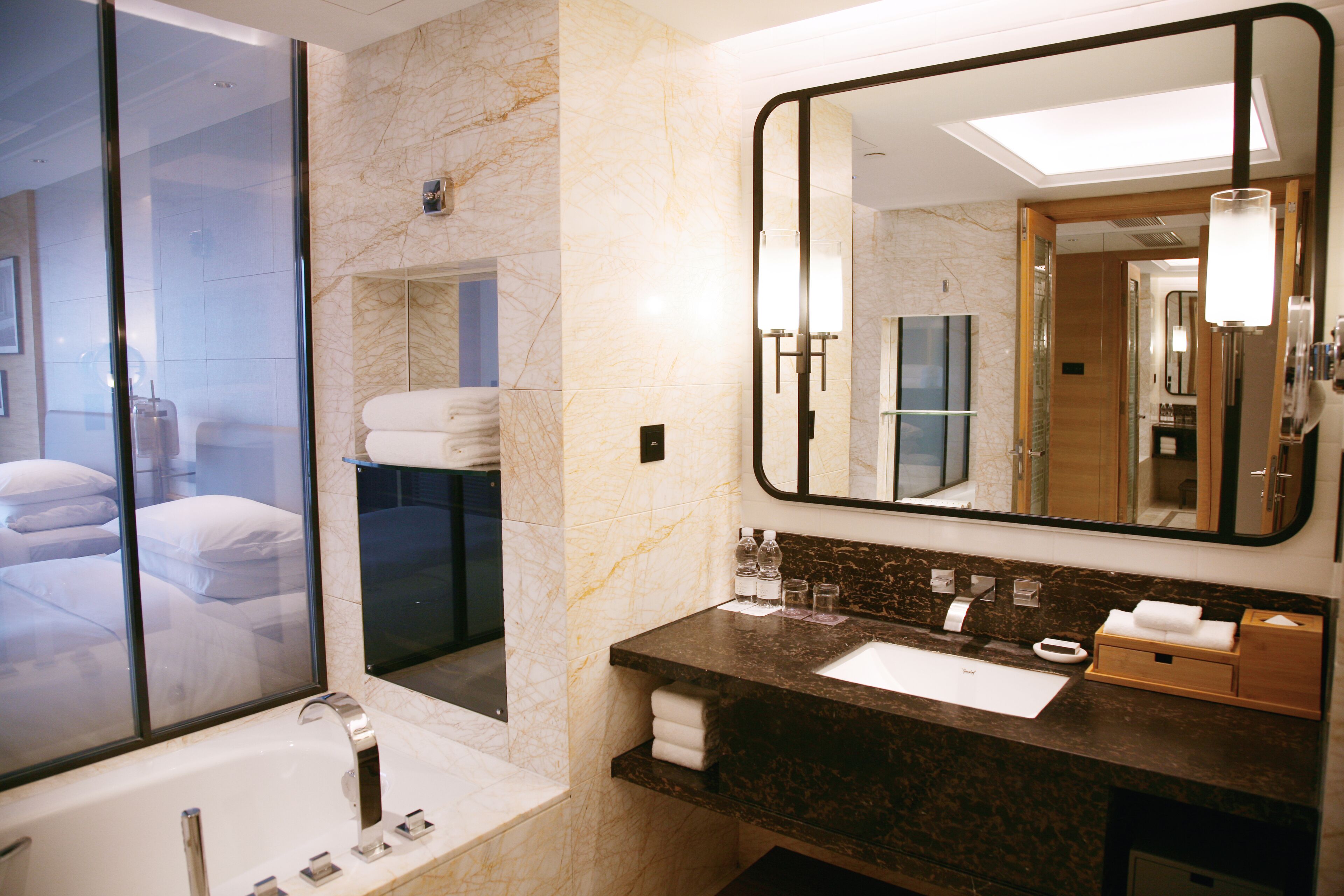 designer toiletries, hair dryer, bathrobes, slippers