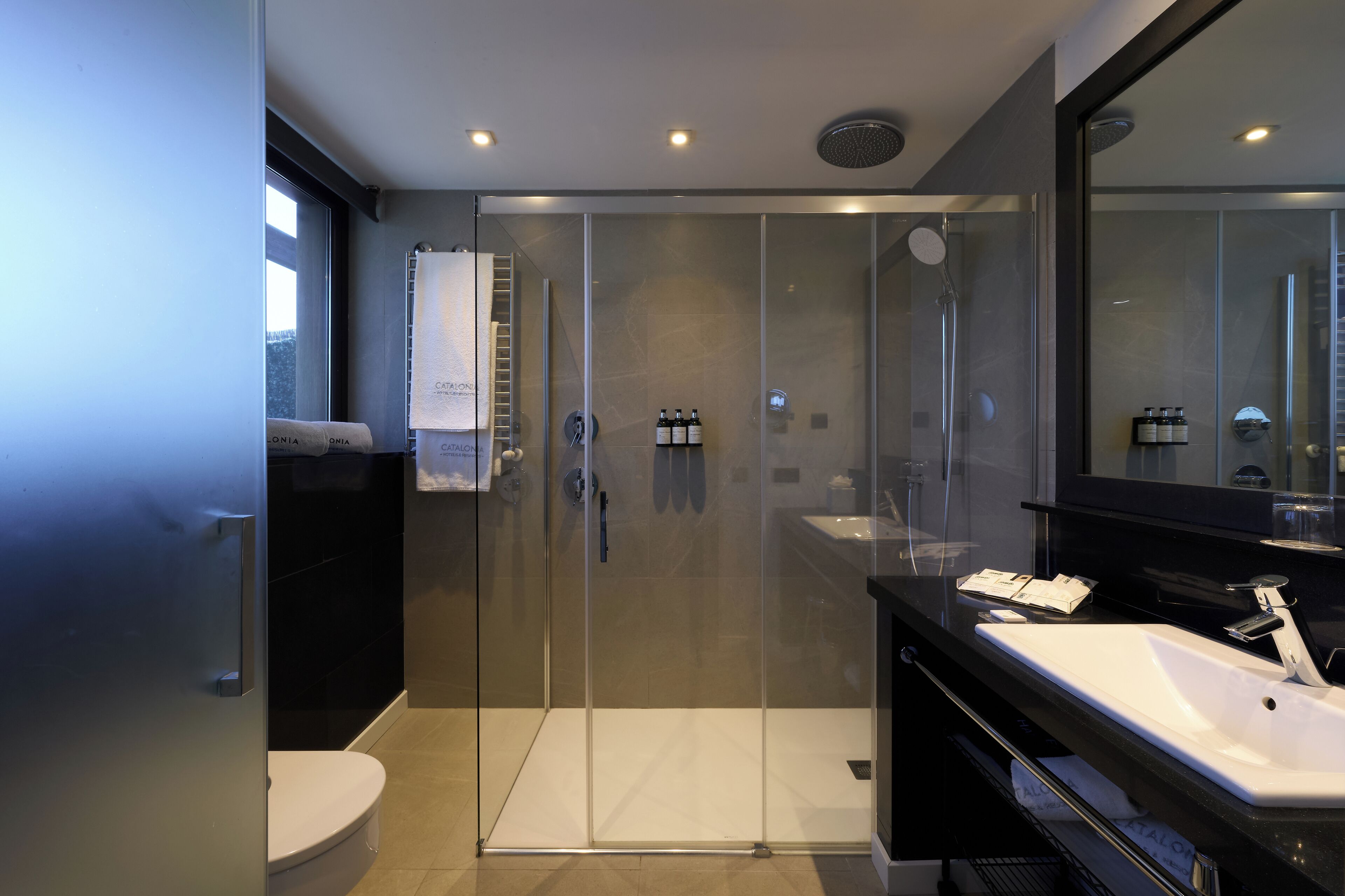 eco-friendly toiletries, hair dryer, towels, soap