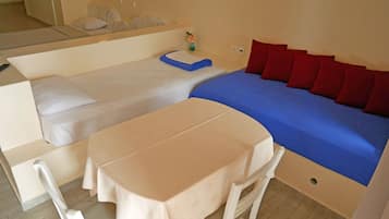 Family Room, Sea View | Living area | Flat-screen TV