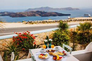 Enjoy a seaside breakfast on the terrace with a view of the ocean and distant islands.